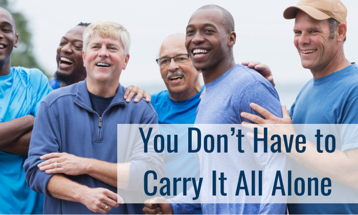 Group of men providing support to each other